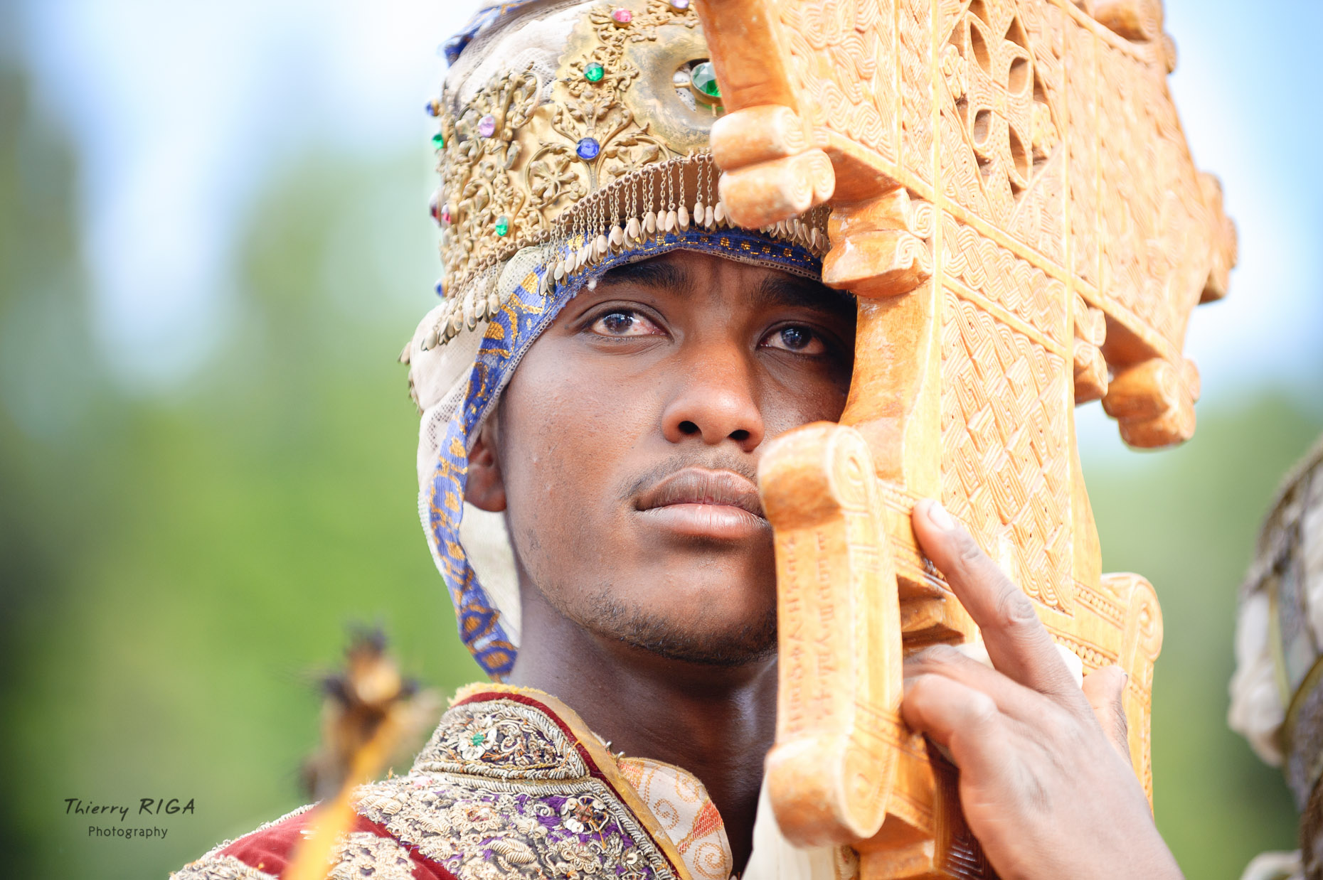 Priest with golden crown and wooden cross during Meskel celebrations in Lalibela, Ethiopia, Thierry Riga