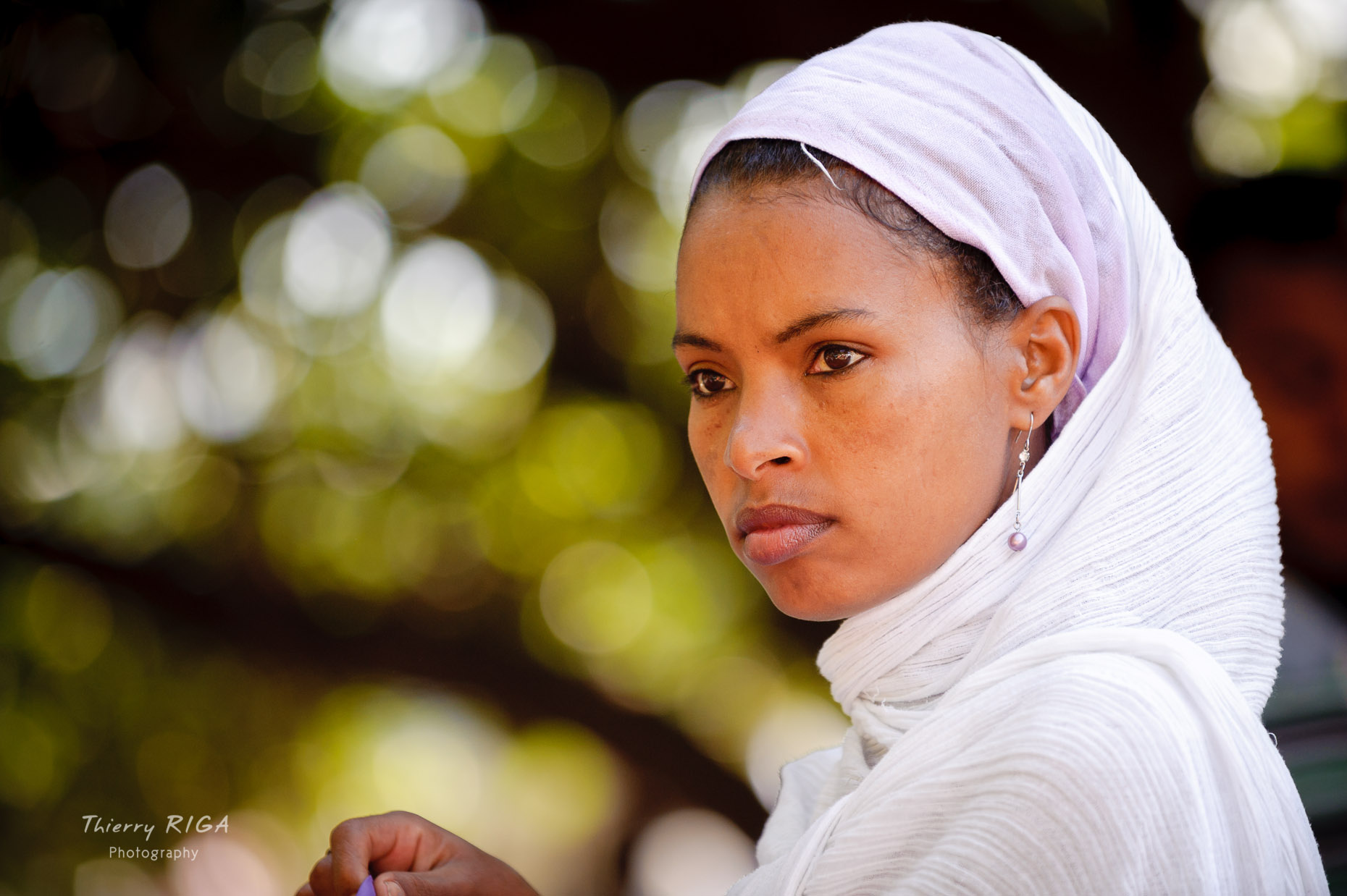 young woman portrait during Meskel ceremonies in Lalibela, Ethiopia