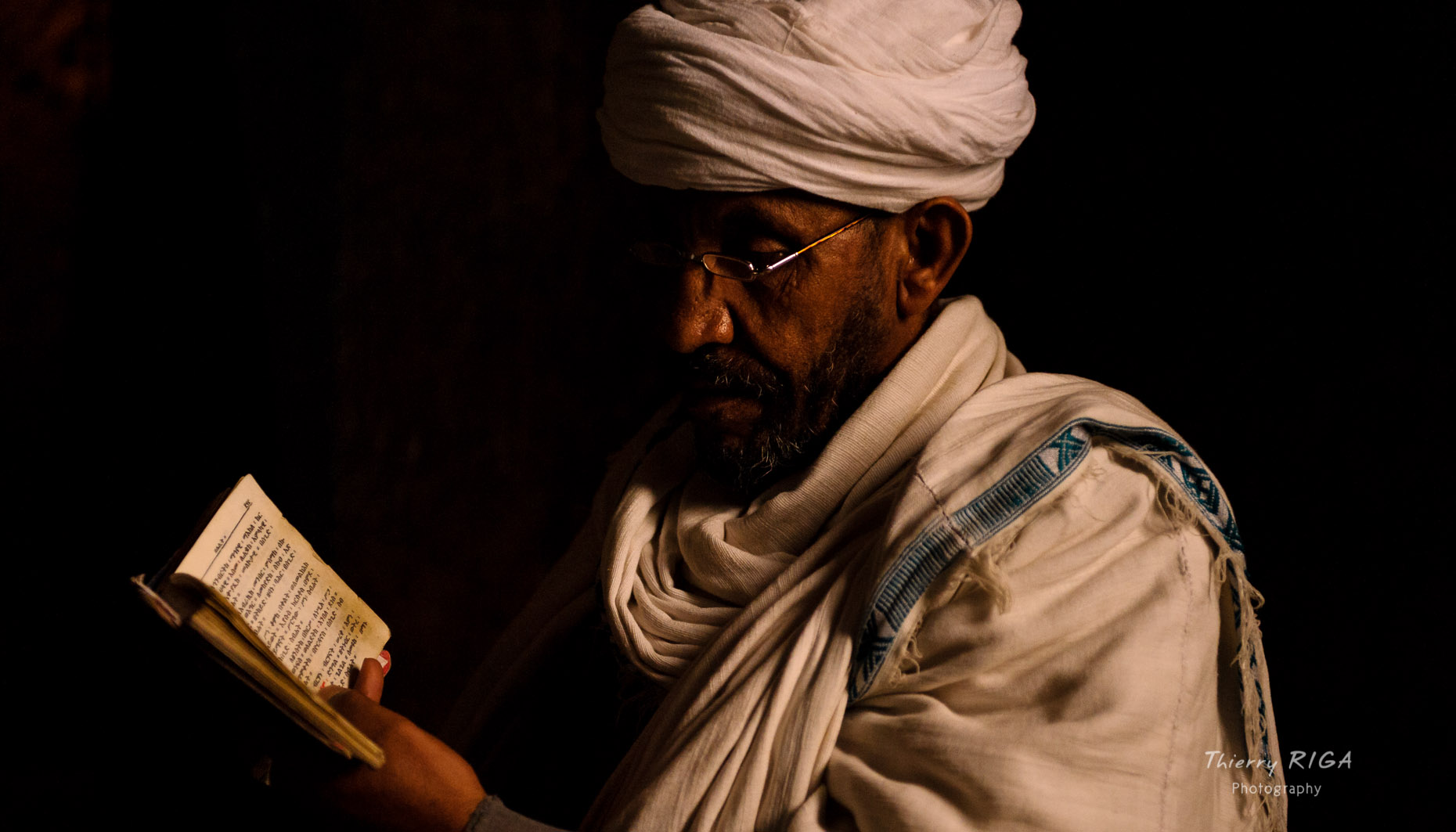 Portrait of a reading old priest in Lalibela, Ethiopia, Thierry Riga