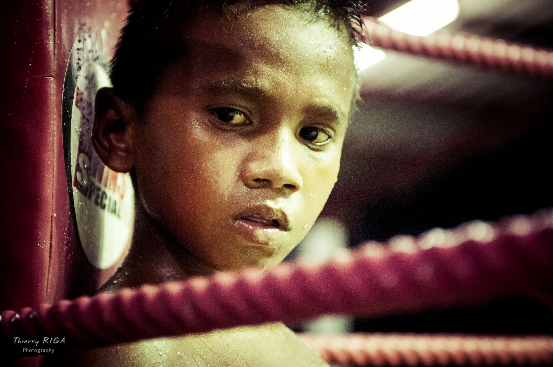 close-up portrait of a kid during his Muay thai boxing tournement, Thailand, Thierry Riga
