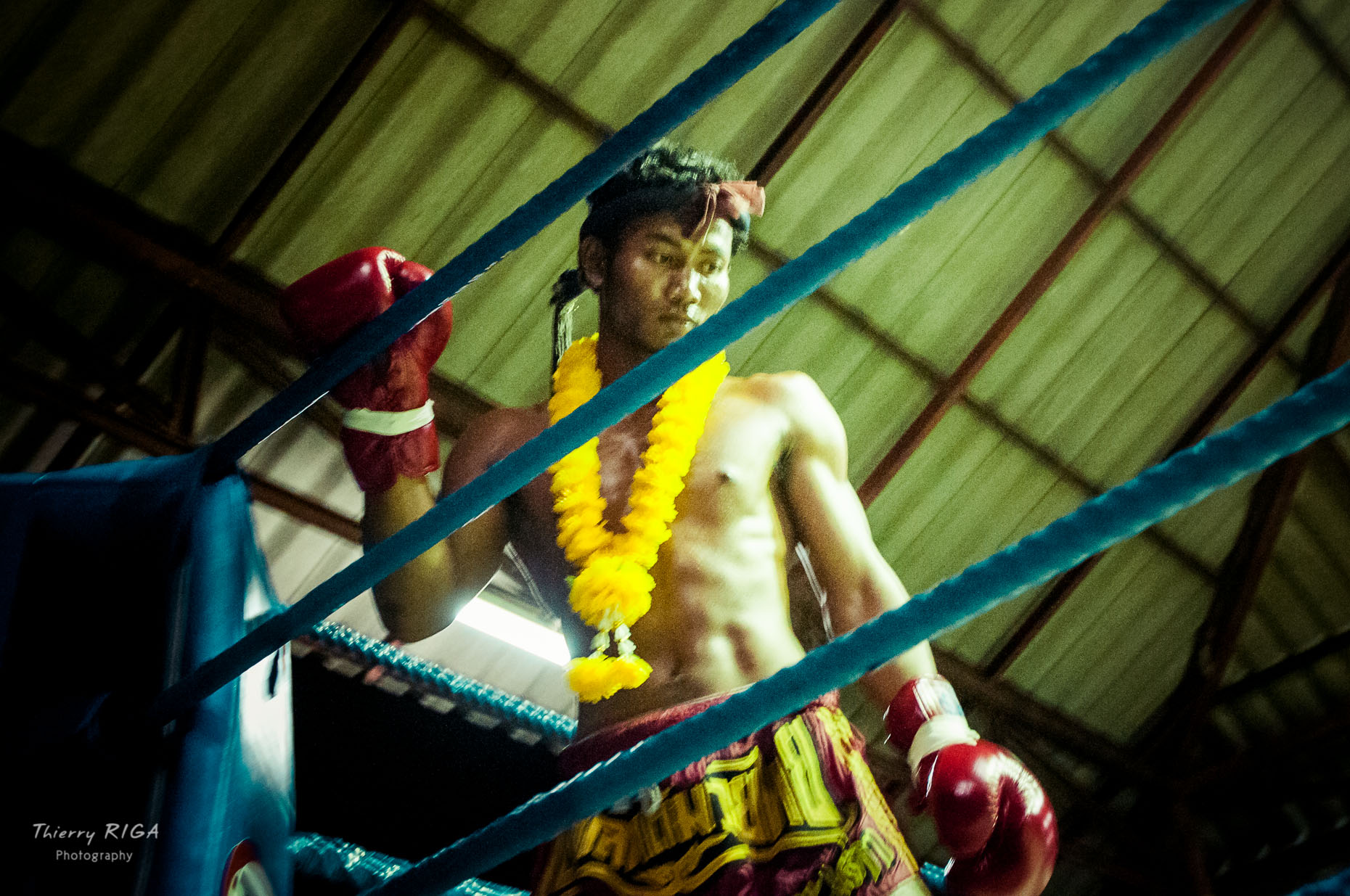 Prying before the fight, Muay Thai ring in a Thailand  village, Thierry Riga