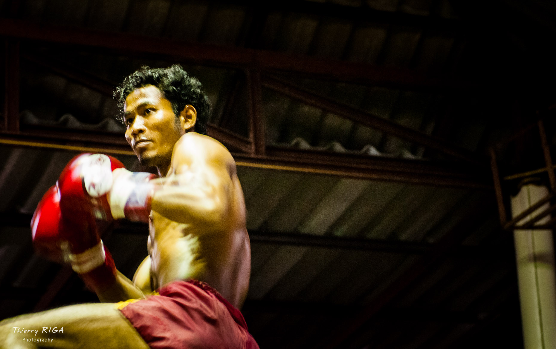 Boxer portrait in action during a fight, Muay Thai