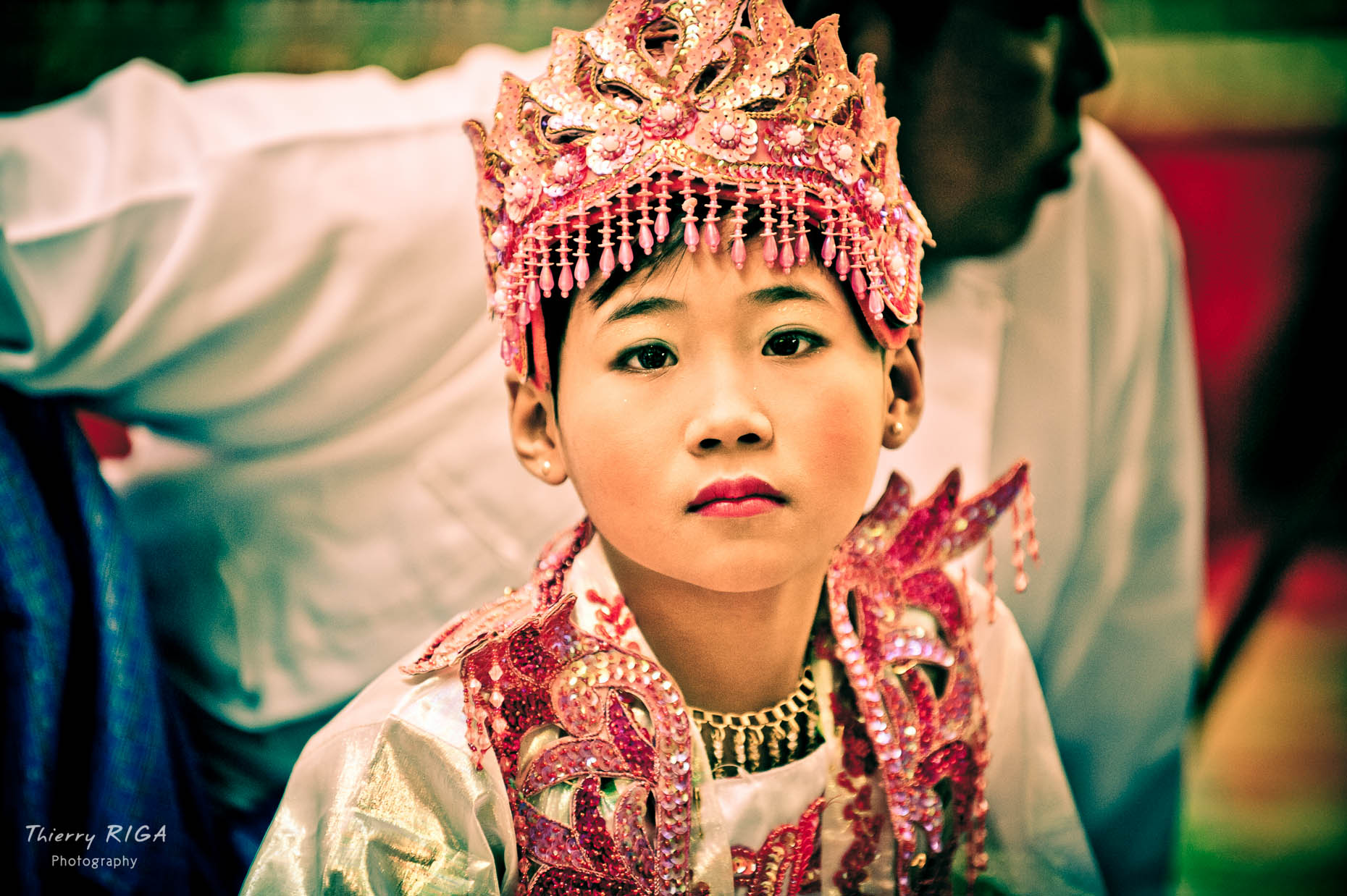 Buddhist novice portrait with pink crown during ordination ceremony, Bagan, Myanmar