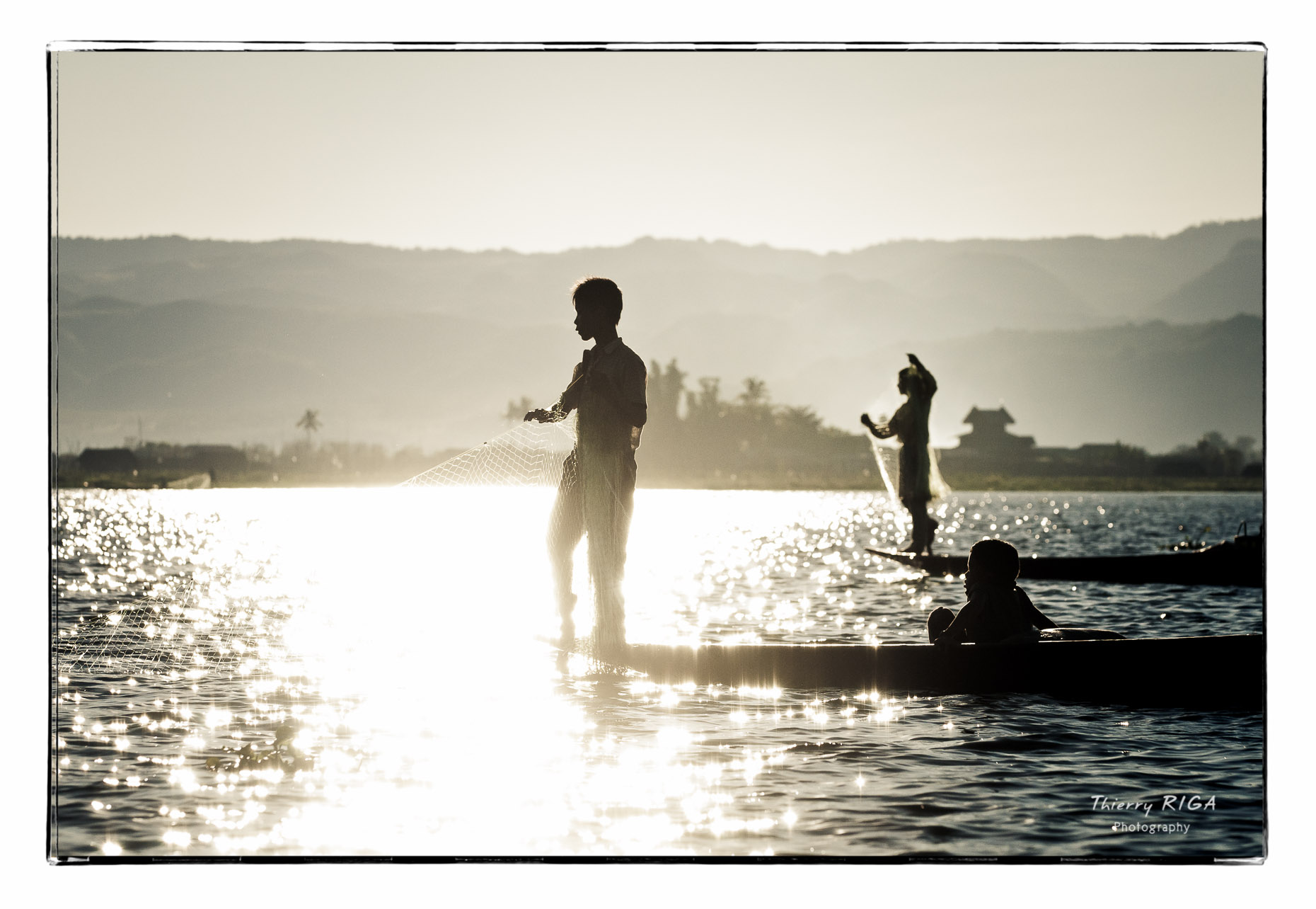 fishermen at sunset on Inlay Lake, Myanmar