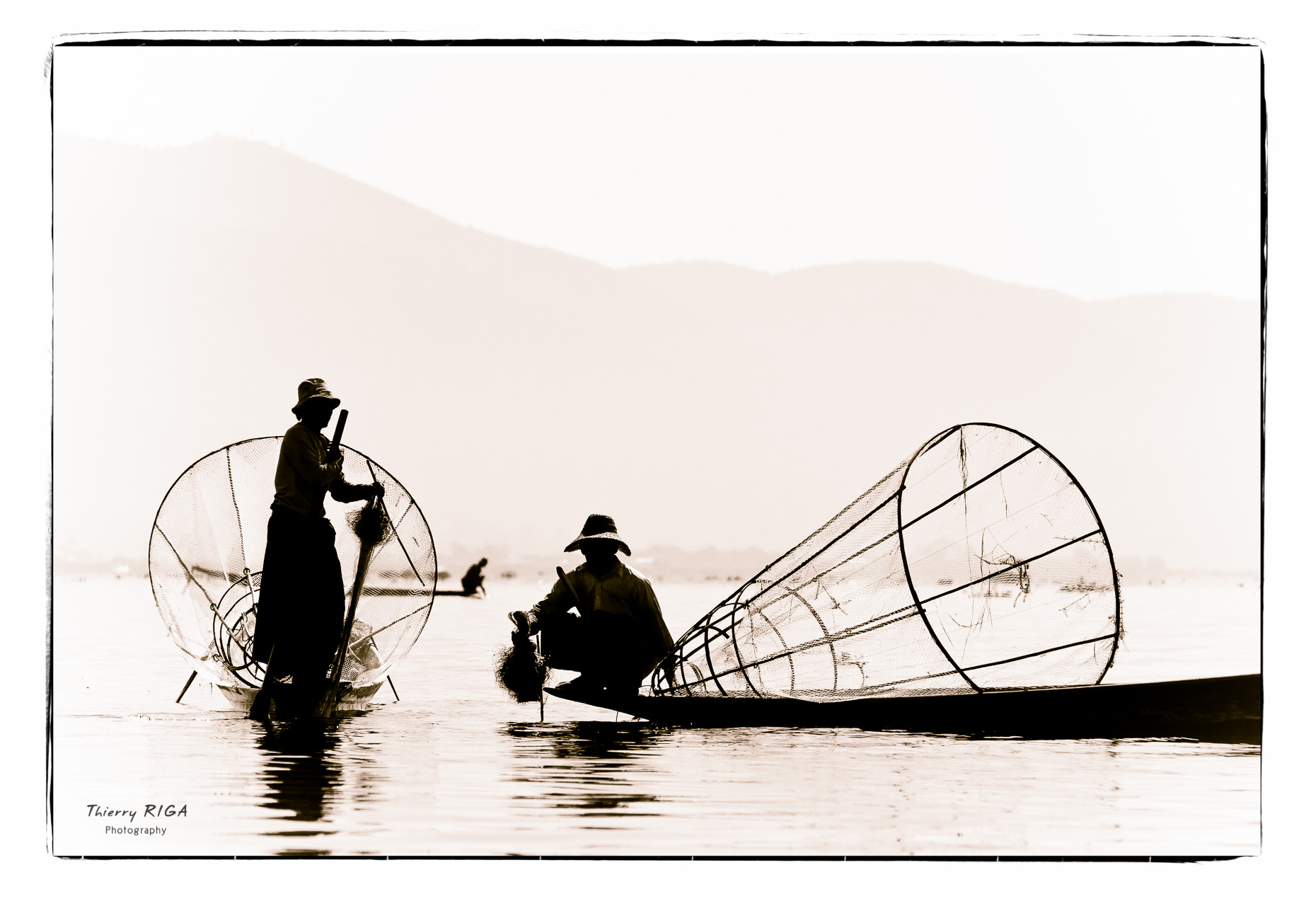 Inlay lake fishermen with their conical nets, Myanmar